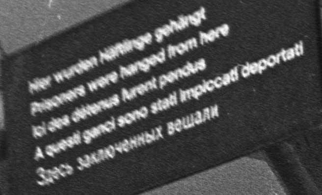 dachau sign: prisoners were hanged from here